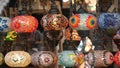 Colourful turkish lamps from glass mosaic glowing. Arabic multi colored authentic retro style lights. Many illuminated moroccan