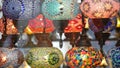 Colourful turkish lamps from glass mosaic glowing. Arabic multi colored authentic retro style lights. Many illuminated moroccan