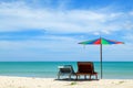 Colourful umbrella with chairs on the beach in summer season Royalty Free Stock Photo