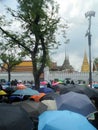 Colourful umbrella cover Thai people dress in black with grieve for the passing of the king, Bangkok , Thailand