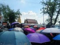 Colourful umbrella cover Thai people dress in black with grieve for the passing of the king, Bangkok , Thailand