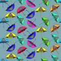 Colourful Umbrellas Seamless Pattern on Blue Background. Vibrant Umbrellas in Various Colours Repeating Design