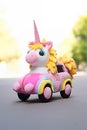 Colourful Unicorn Car Plush Toy on a Road