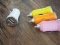 Colourful USB Car Charger on a wooden board with technology and energy concept Royalty Free Stock Photo