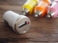 Colourful USB Car Charger on a wooden board with technology and energy concept Royalty Free Stock Photo