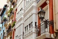 Colourful vintage facades of different vivid colours with elegant lantern in Bilbao, Basque Country, Spain