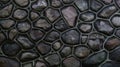 Colourful wall made of stone and cement. Mosaic of rocks used as tiles. Pale color dark stone fence. Decorative texture from