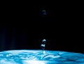 Colourful water drop splash - water droplet on dark background - ocean blue water droplet