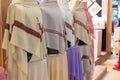 Colourful white male dishdash head scarfs lines up for sale in at Global Village Market in Dubai, United Arab Emirates