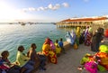 Colourful womens and kids watching ships on the beach in Zanzibar - ÃÂ°ndian ocean in Tanzania, Africa