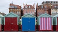 Colourful wooden beach huts on the sea front in Hove, Sussex, UK. Royalty Free Stock Photo