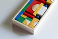 Colourful wooden toy blocks arranged in the shape of a puzzle on white background Royalty Free Stock Photo