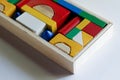 Colourful wooden toy blocks arranged in the shape of a puzzle on white background Royalty Free Stock Photo