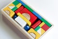 Colourful wooden toy blocks arranged in the shape of a puzzle on white background Royalty Free Stock Photo