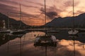 Colourful yachts docked at marina of Lecco town on spring sunset. Picturesque waterfront of Lecco located between famous Lake Como Royalty Free Stock Photo