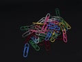 Colourfull paperclips with a black and white background