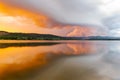 Sunset with heavy clouds at lake in France Royalty Free Stock Photo