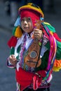 A colourfully dressed boy performs down a Cusco street during the May Day parade in Peru. Royalty Free Stock Photo