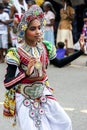 A colourfully dressed dancer performs during the Hikkaduwa Perahera in Sri Lanka.