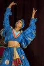 A colourfully dressed female performer at the Esala Perahera theatre performance in Kandy, Sri Lanka.