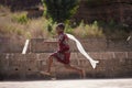 Colourfully Dressed Little African Girl Running With Her White Scarf Flowing In The Wind