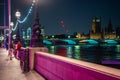 Colourfully lit night scene with The Houses of Parliament in the background Royalty Free Stock Photo