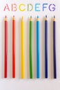 Colouring pencils pointing at ABCs Royalty Free Stock Photo