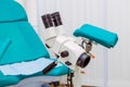 Colposcope and chair in the gynecology office. Selective focus Royalty Free Stock Photo