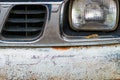 Colse up to decay and rust on the front bumper of an old white truck. Royalty Free Stock Photo