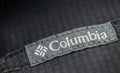 Columbia brand label close-up on a black cotton shirt