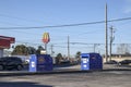 Blue ORION Trash waste dumpsters in an urban area on a clear blue sky day