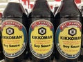 Kikkoman soy sauce in a glass jar in a retail store row