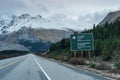 Columbia Icefield road sign. Snow-capped Wilcox Peak in in the background.