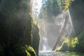 Columbia River Gorge - Hood River, Oregon. Sun shines on Small waterfall and forest stream Royalty Free Stock Photo