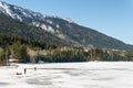 Columbia-Shuswap, CANADA - MARCH 17, 2019: people on the ice of frozen Three Valley Lake