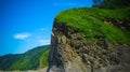 Column basalts formation of Stolbchaty cape at Kunashir, kuril islands, Russia Royalty Free Stock Photo