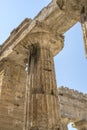 Column and capitol at Neptune Doric temple , Paestum, Italy Royalty Free Stock Photo