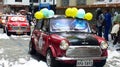 Column of classic cars in carnival parade