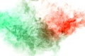 clouds of smoke and patterns texture of different forms of red and green colors with tongues of flame on a white isolated