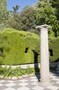 Column and garden. Royalty Free Stock Photo