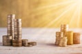 Column of golden coins on wooden background Royalty Free Stock Photo