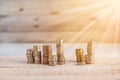 Column of golden coins on wooden background Royalty Free Stock Photo