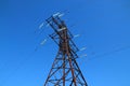 High-voltage lines on a big opera against a clear sky