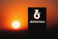 Column with logo of Benzina company.