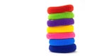 Column of multicolored scrunchies, elastic hair ties, cotton hair ponytail holders, seamless hair bands Royalty Free Stock Photo