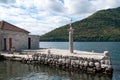 Column on the pier of Our Lady of the Rocks island in Kotor, Montenegro Royalty Free Stock Photo