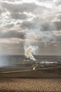 Column of smoke in the middle of a rainfed farm Royalty Free Stock Photo