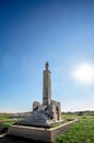 The column of St. Mary of Roca, near the famous La `Grotta della Poesia` with the sun in the background Royalty Free Stock Photo