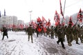 Column of Ukrainian far-rightists marching on the street with flags in hands Royalty Free Stock Photo