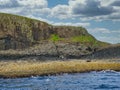 Columns of jointed volcanic basalt rocks on the island of Staffa in the Inner Hebrides, Scotland Royalty Free Stock Photo